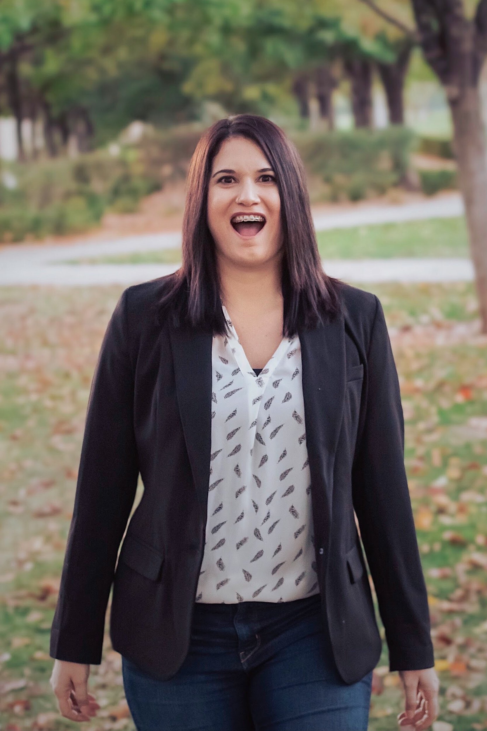 woman in a park with a silly facial expression