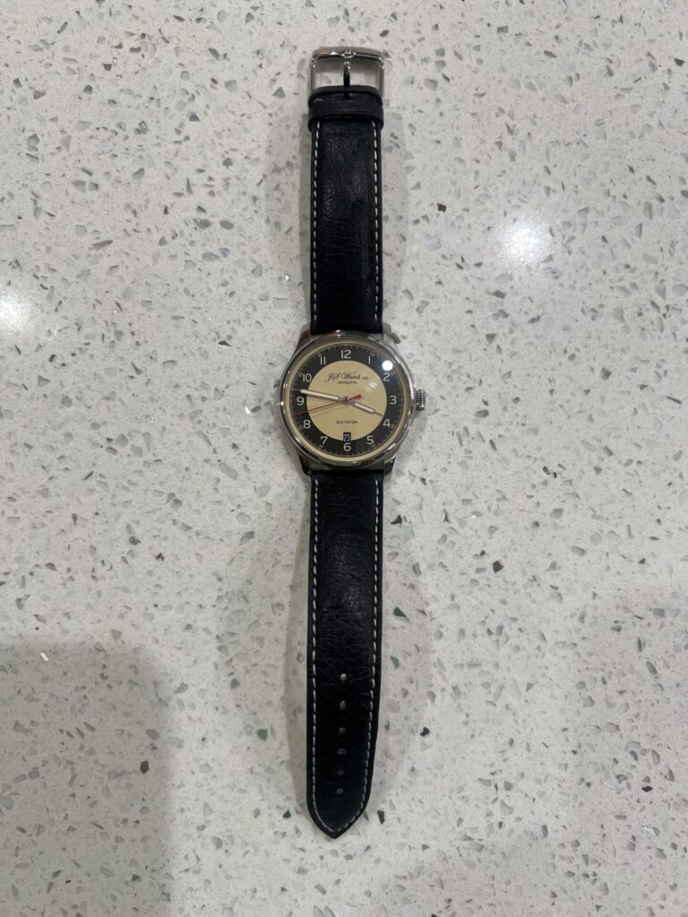A cell snapshot of a watch taken with a phone, meant to show how a phone fails to deliver professional results.